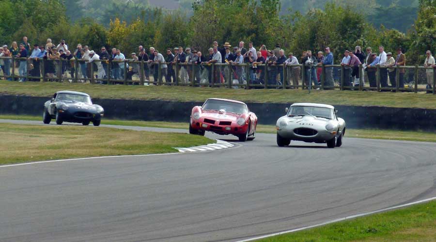 Ferrari and Jaguar battle in the RAC TT Celebration race at the Goodwood Revival